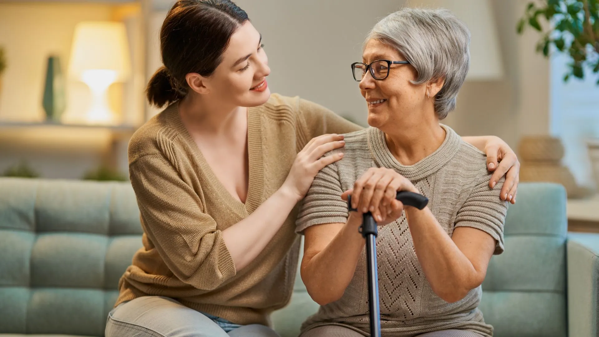 Rehabilitation specialist helps a guy to do exercises for recovery from injury, who is sitting in a wheelchair with a corset around his neck. Concept of physical therapy for people with disabilities